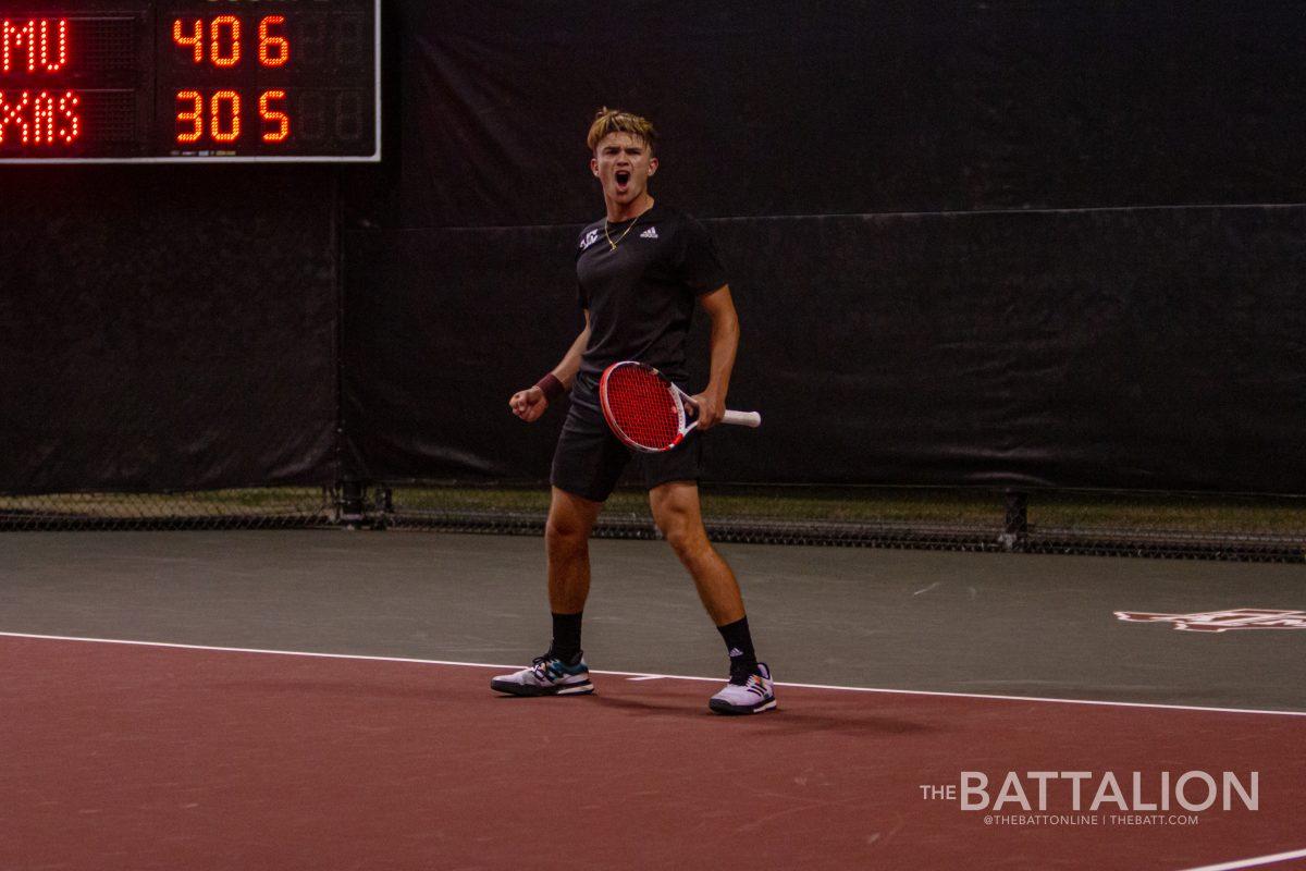 Sophomore Raphael Perot celebrates after taking the lead over Richard Ciamarra of the University of Texas at the Mitchell Tennis Center on Wednesday, Mar. 9, 2022.