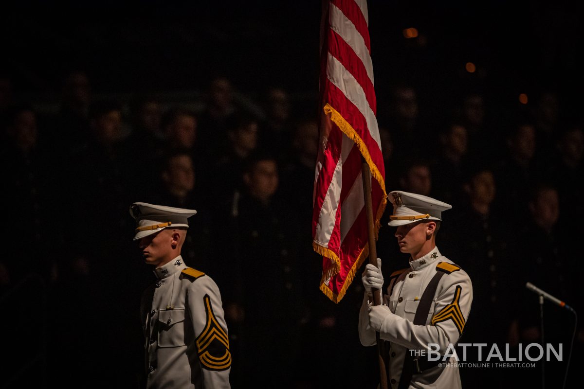 Cadets from the Ross Volunteers bring the American flag on stage during Muster in Reed Arena on Thursday, April 21, 2022.