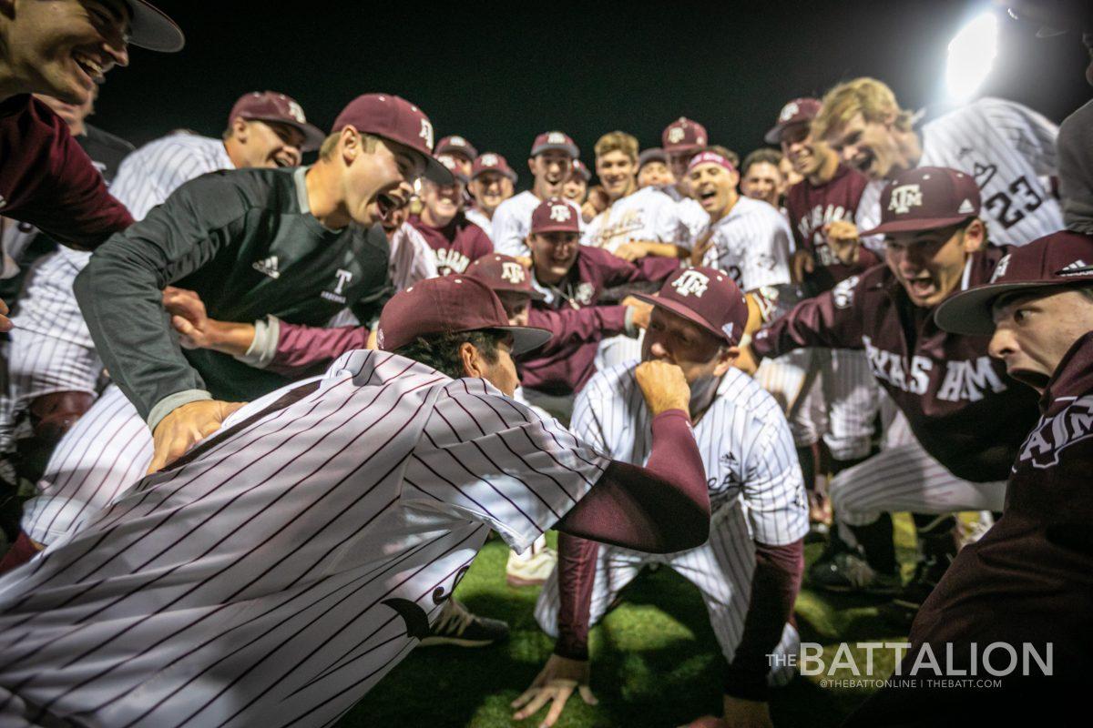 Head coach Jim Schlossnagle (22) accepts the celebratory chip on Olsen Field at Blue Bell Park on Friday, April 8, 2022.