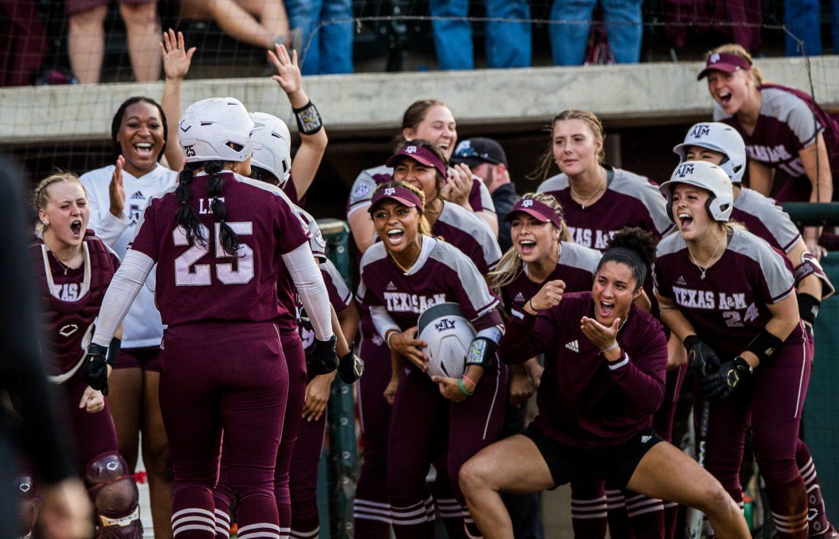 The team celebrates after Haley Lee (25) brings in a home run Davis Dimond on Saturday, April 23. 