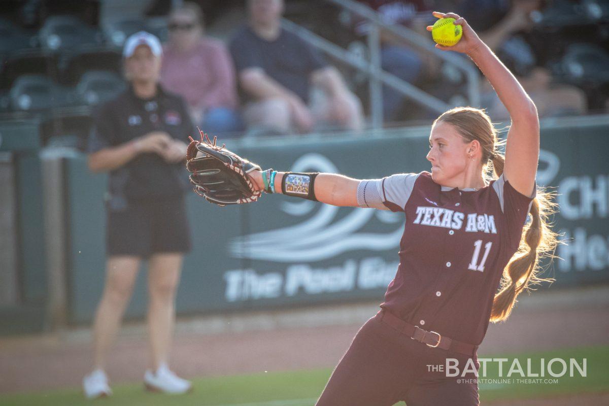 <p>Freshman P/1B Emiley Kennedy (11) pitches during the top of the third inning in Davis Diamond on Wednesday, April 27, 2022.</p>