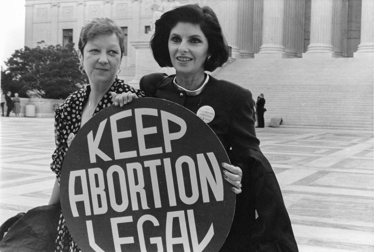 Norma McCorvey, left, who was Jane Roe in the 1973 Roe v. Wade case, with her attorney, Gloria Allred, outside the Supreme Court in April 1989, where the Court heard arguments in a case that could have overturned the Roe v. Wade decision.