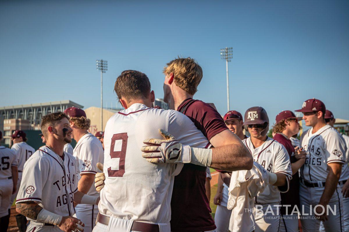 Junior RF Brett Minnich (23) celebrates with sophomore 1B Jack Moss (9) after Minnich hit a walk-off home run at Olsen FIeld on Saturday, May 7, 2022.