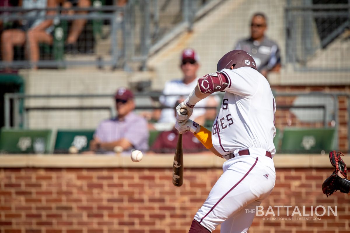 Senior C Troy Claunch (12) hits a ball during the Aggies' game against Mississippi State at Olsen Field on Saturday, May 14, 2022.