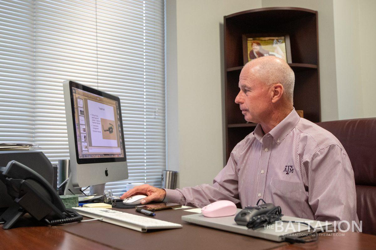 Texas A&M athletics physician Dr. J.P. Bramhall works in his office on Wednesday, April 4, 2022.