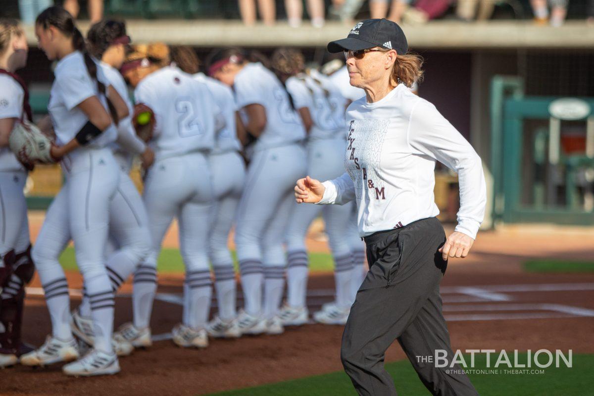 A&M coach Jo Evans takes the field as the Aggies take on the Crimson Tide at Davis Diamond on Friday, April 22, 2022.
