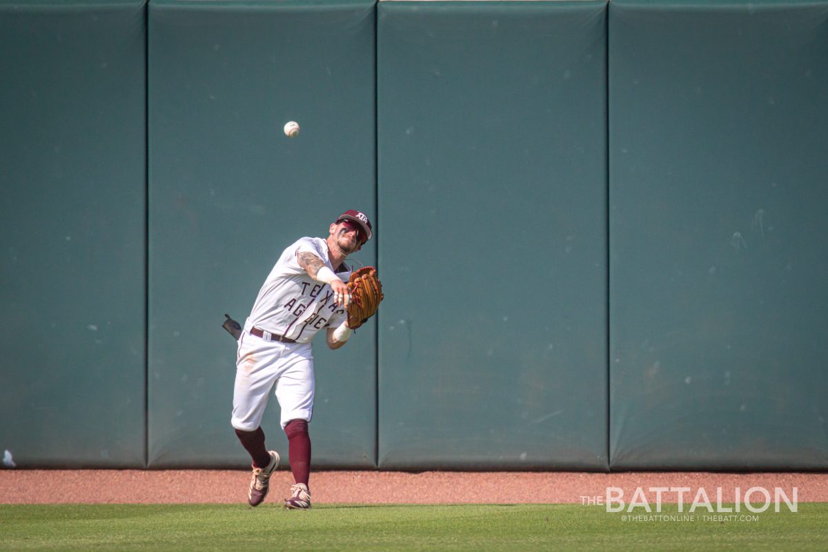 Junior CF Jordan Thompson (31) throws a caught flyball towards the pitcher's mound at Olsen FIeld on Saturday, May 7, 2022.