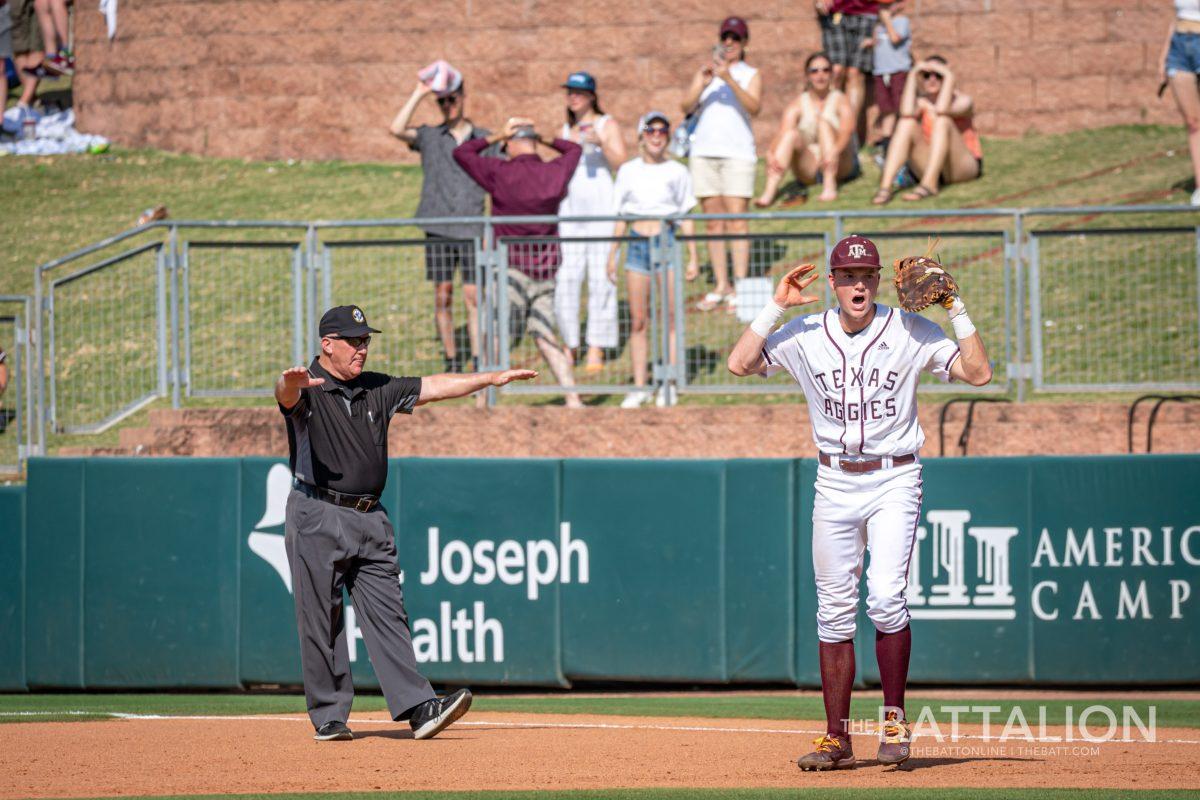 <p>Sophomore 1B Jack Moss (9) reacts to Mississippi State C Logan Tanner (19) being called safe at first denying the Aggies' final out against Mississippi State at Olsen Field on Saturday, May 14, 2022.</p>