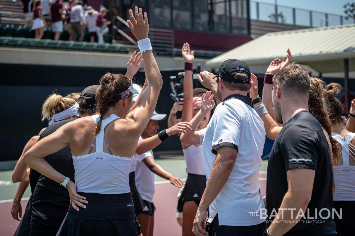 The Texas A&M womens tennis team celebrates after earning their first point in their match against Baylor in the second round of the NCAA Womens Tennis Championship tournament at the Mitchell Tennis Center on Saturday, May 7, 2022.