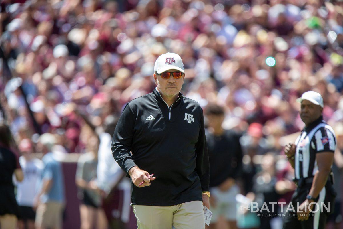 Coach Jimbo Fisher walks across the field in between plays in Kyle Field on April 9, 2022.