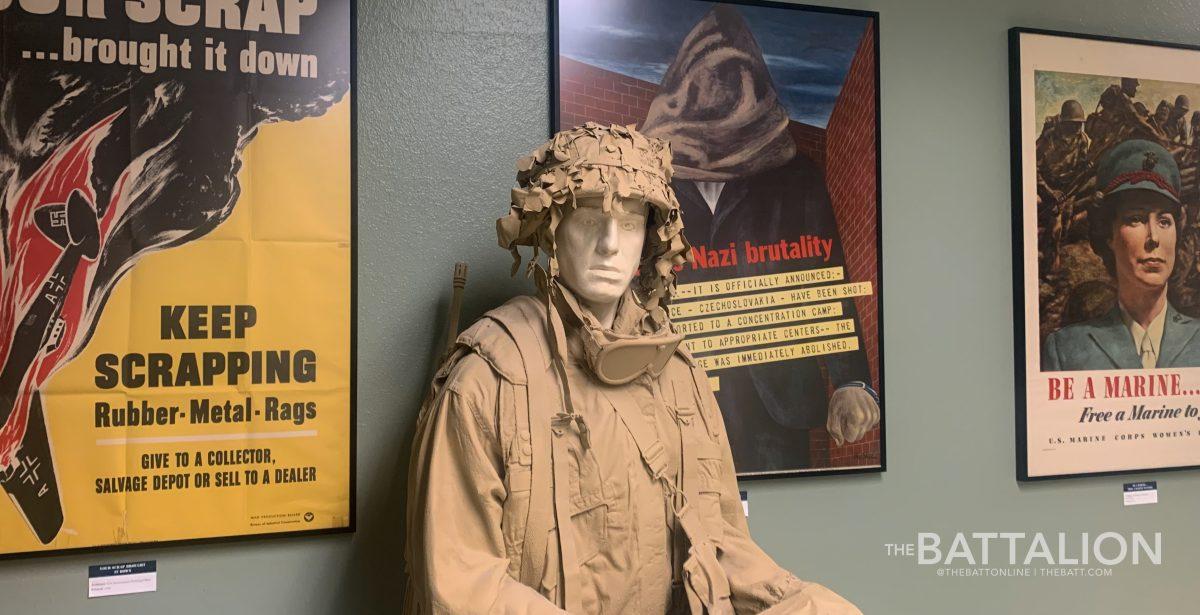 A mannequin in a soldiers uniform at the Museum of the American G.I. in College Station on Friday, June 3, 2022. Behind the mannequin are posters from the time of World War II.