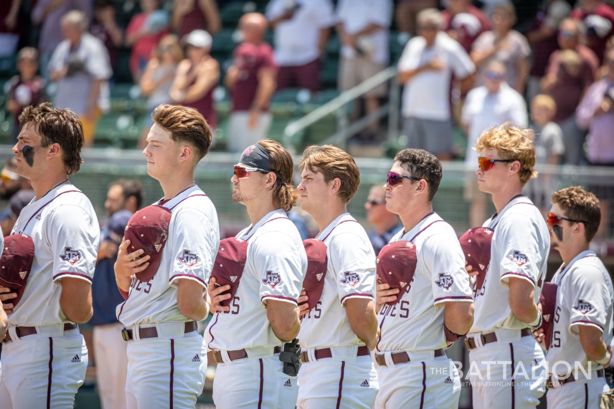 The Aggies' starting lineup stands for the National Anthem prior to the start of their game against Oral Roberts in the first game of the College Station Regional at Olsen Field on Friday, June 3, 2022.