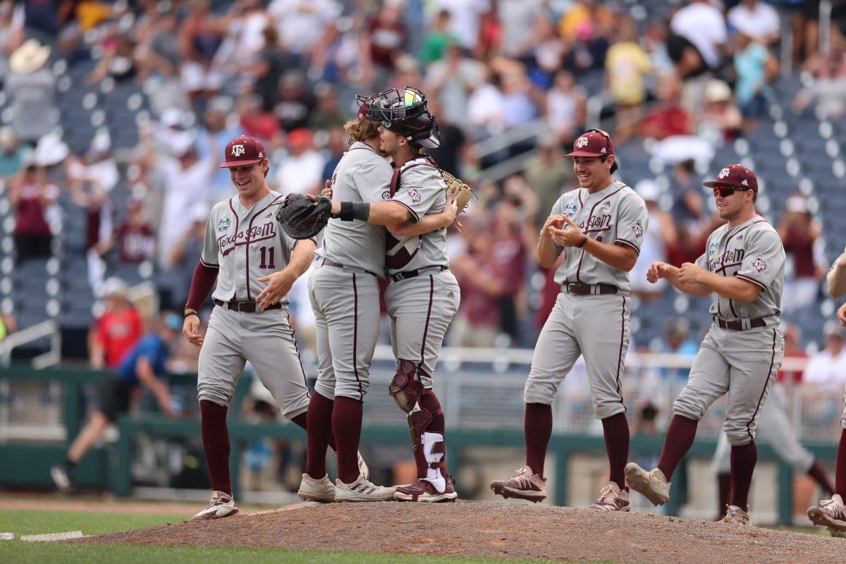 Junior+lefty+Joseph+Moo+Menefee+%286%29+and+graduate+catcher+Troy+Claunch+%2812%29+hug+on+the+mound+after+5-1+win+over+Notre+Dame+on+Tuesday%2C+June+21.