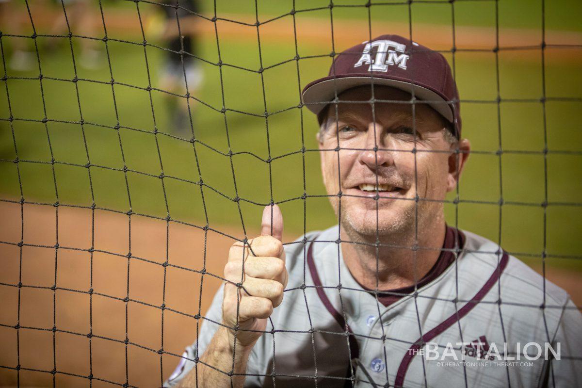 A&M coach Jim Schlossnagle speaks with family in the crowd after winning the College Station regional at Olsen Field on Monday, June 6, 2022.