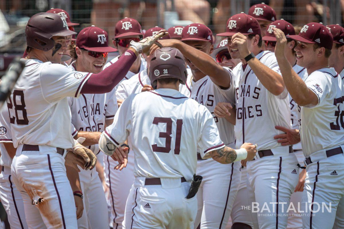 Junior CF Jordan Thompson (31) celebrates with his teammates after scoring a home run at Olsen Field on Friday, June 3, 2022.