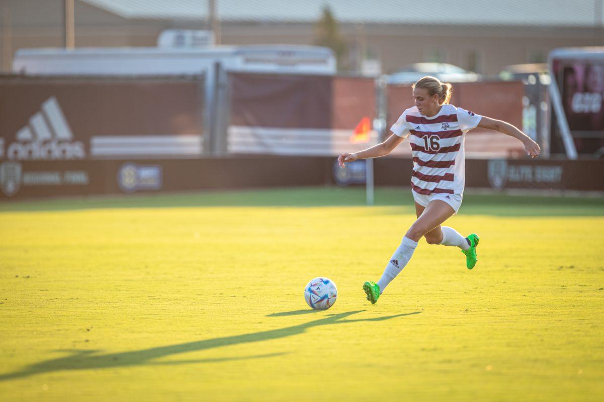 Carolyn Calzada (16) kicks the ball down the field on Aug. 11 at Ellis Field during Texas A&M exhibition game against SFA.