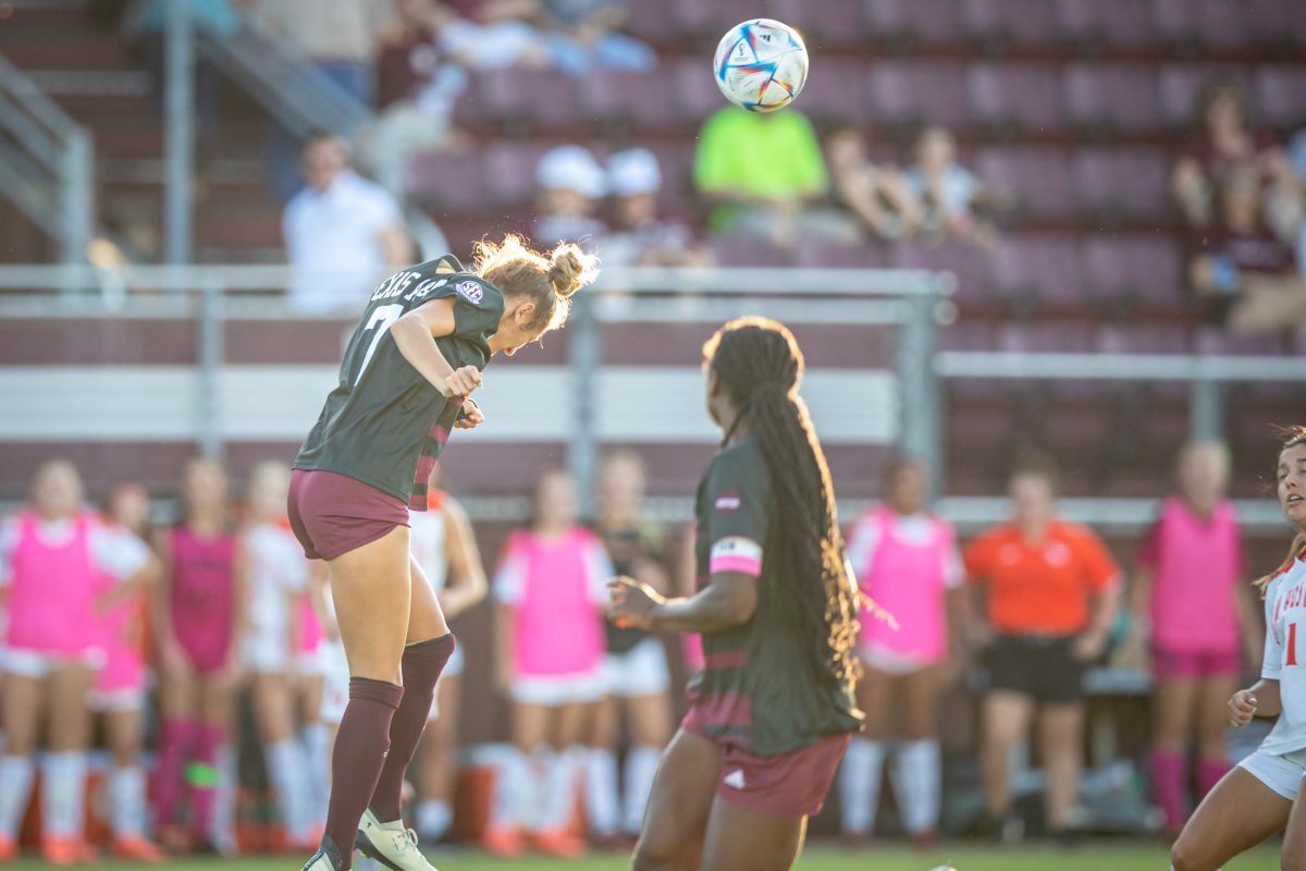 Senior D Katie Smith (7) hits the ball downfield during the Aggies game against Sam Houston at Ellis Field on Thursday, Aug. 25, 2022.