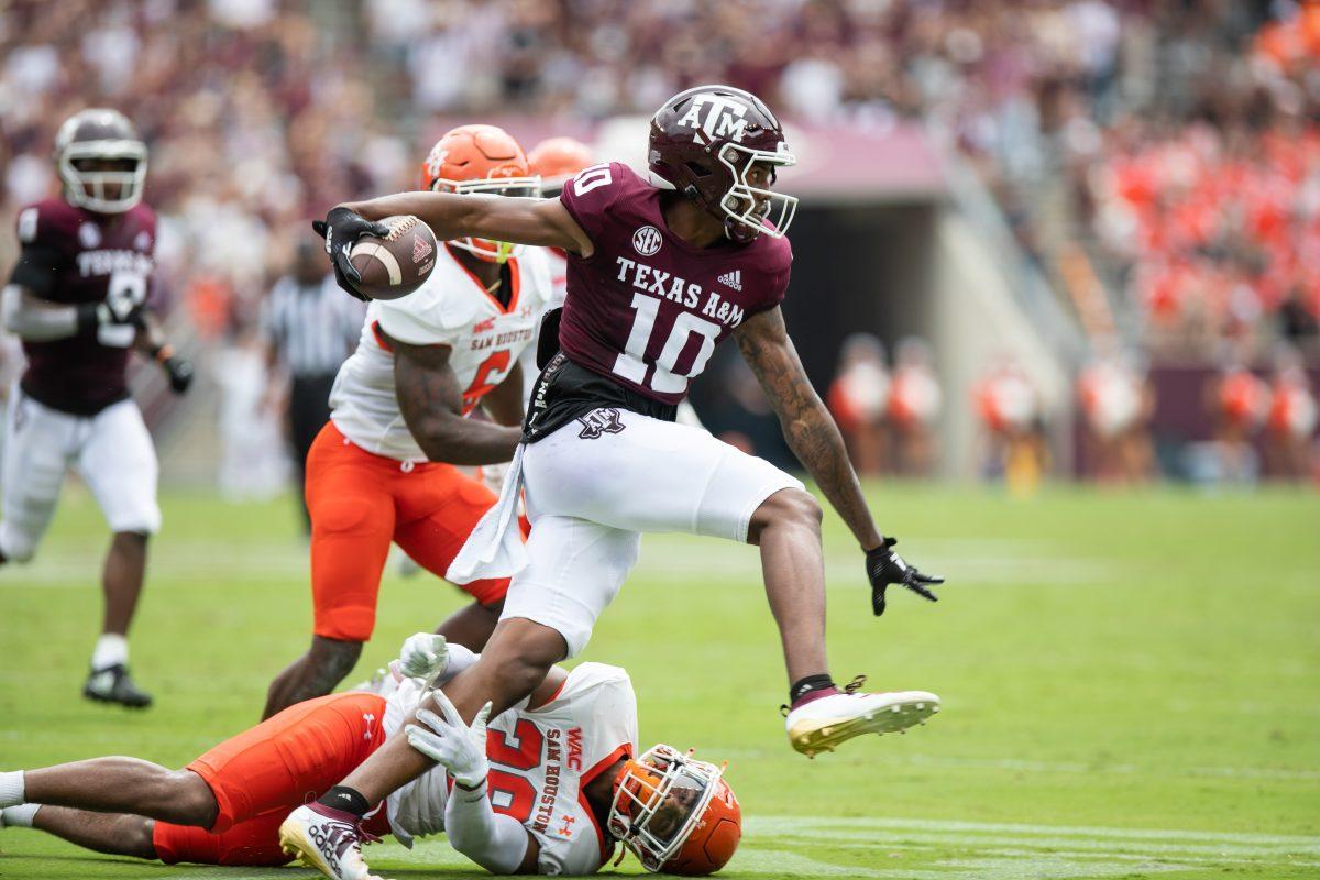 Freshman WR Chris Marshall (10) jumps over Sam Houstons Quan Williams (38) at Kyle Field on Saturday, Sep. 3, 2022