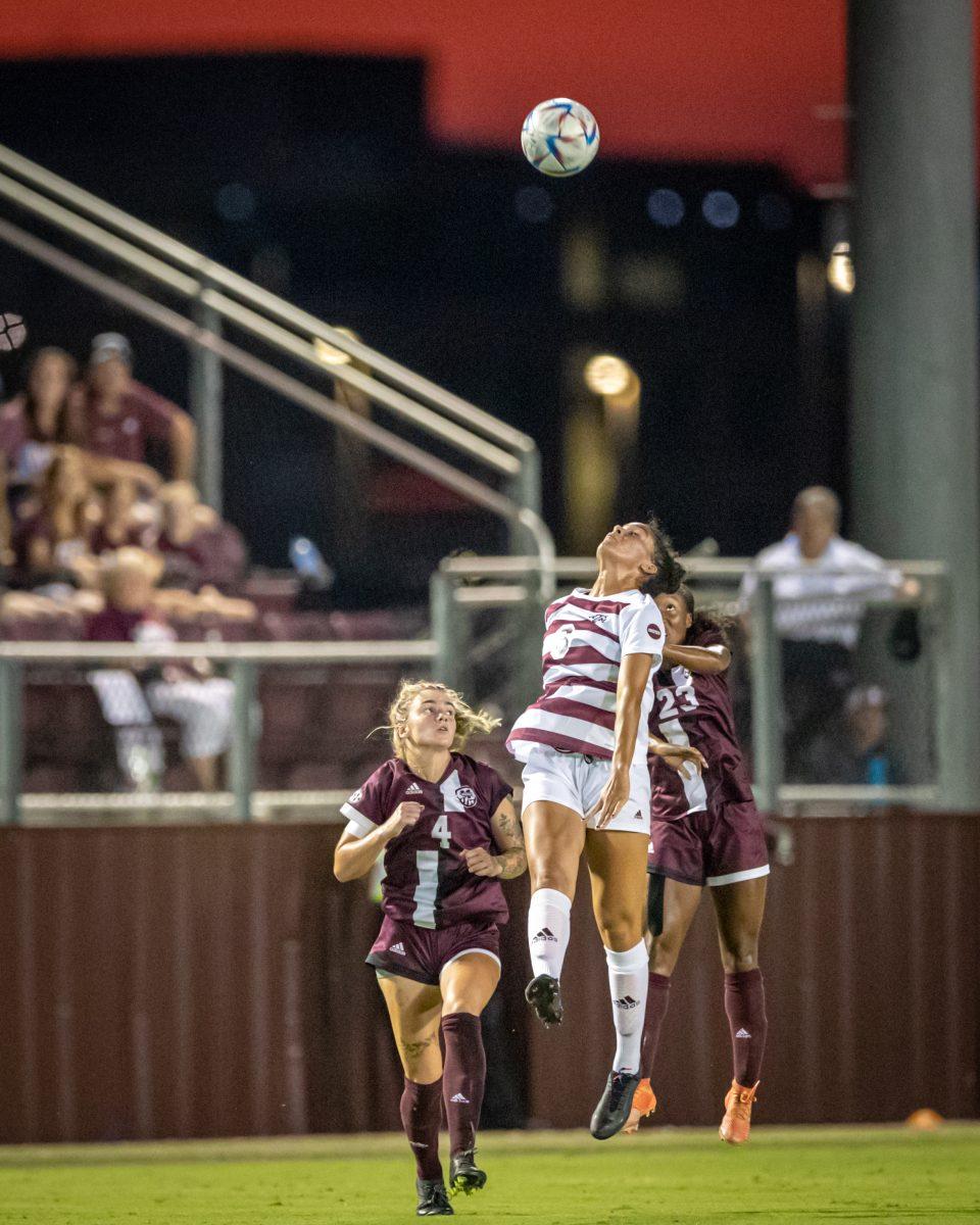 Redshirt freshman Andersen Williams (6) jumps to head the ball during the Aggies match against Mississippi State at Ellis Field on Thursday, Sept. 22, 2022.