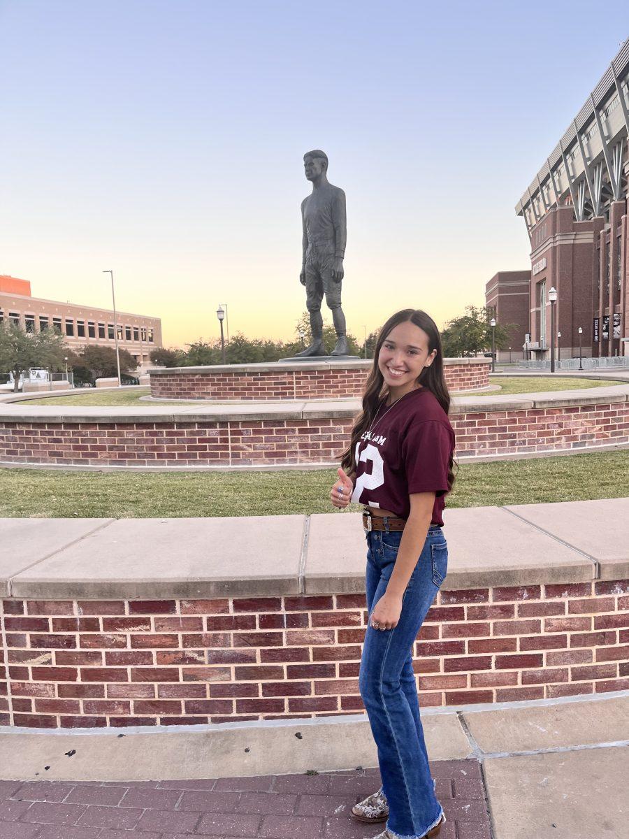 Forensic investigative sciences freshman Briani Plancarte-Saenz standing by the 12th Man Statute after being announced as the Student Government Association's fall 2022 Freshman Class President&#160;