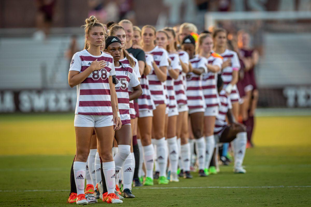 The Aggies stand during the national anthem before the start of the Aggies match against Mississippi State at Ellis Field on Thursday, Sept. 22, 2022.