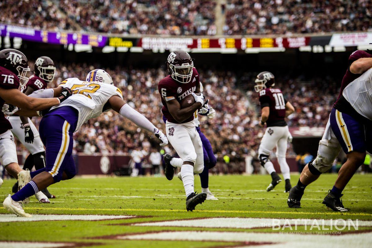 <p>Sophomore <strong>Devon Achane </strong>leaps into the endzone at Kyle Field against Prairie View A&M on Saturday, Nov. 20.</p>