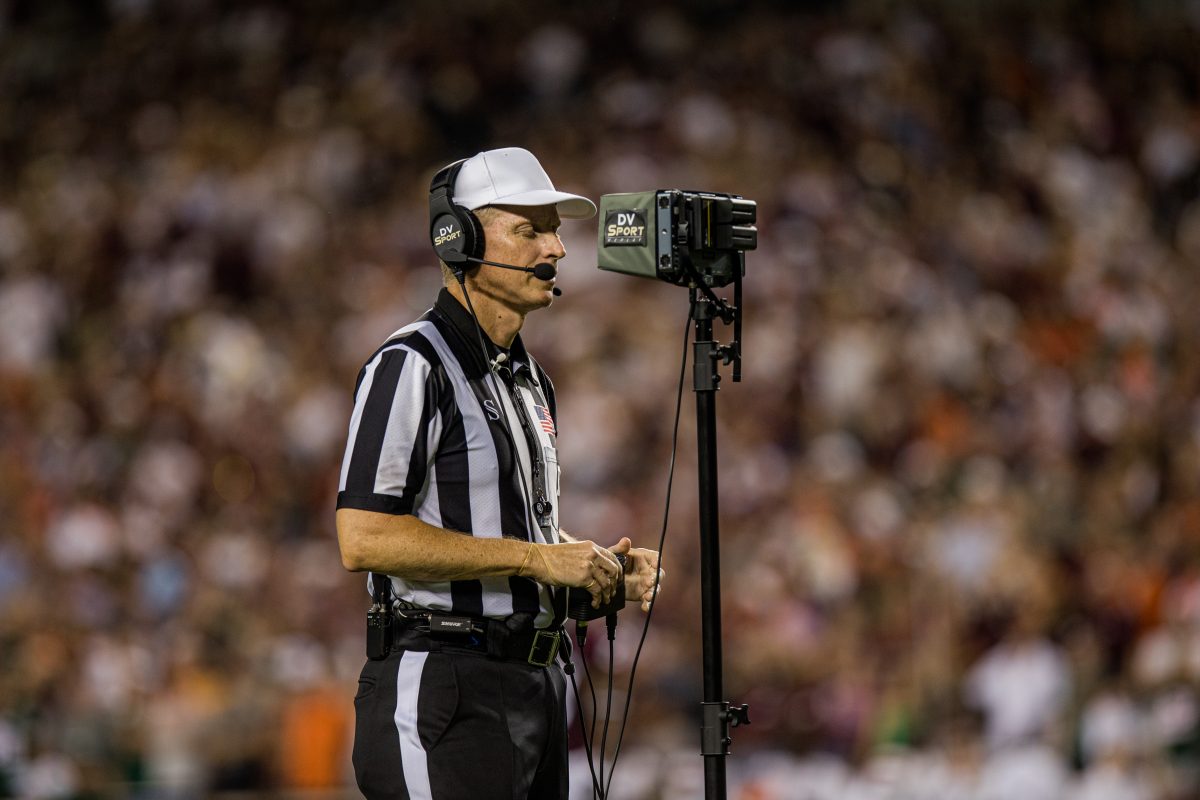 <p>The referee reviews video replay of a challenged play during Texas A&M's game against Miami at Kyle Field on Saturday, Sept. 17, 2022.</p>