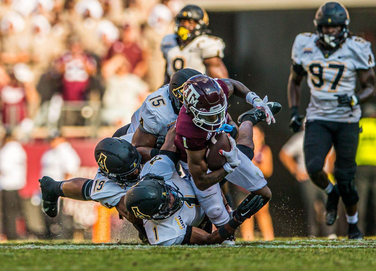 Freshman WR Evan Stewart (1) gets tackled to the ground at Kyle Field on Saturday, Sept. 10, 2022.