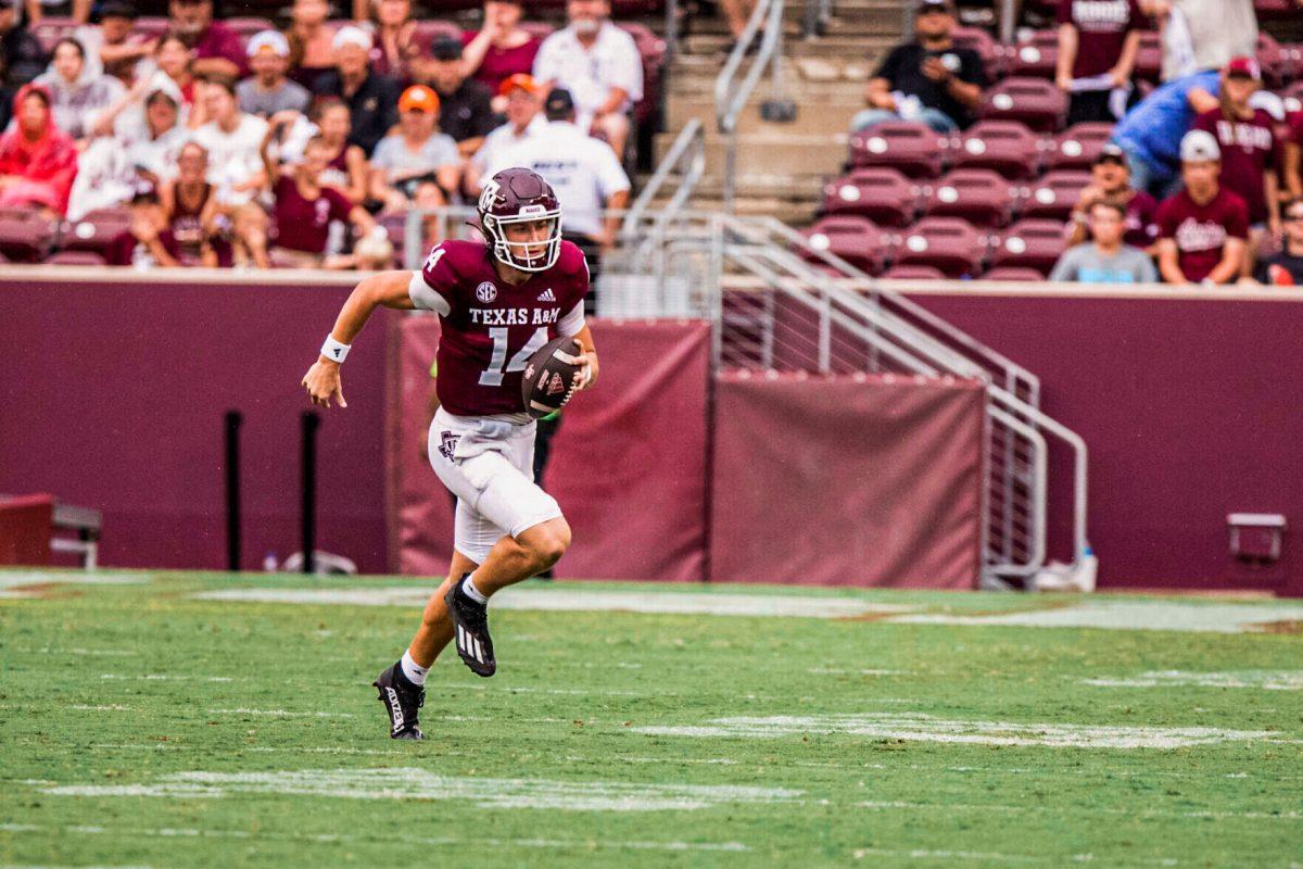 Junior QB Max Johnson (14) runs with the ball at Kyle Field on Saturday, Sept. 3, 2022.