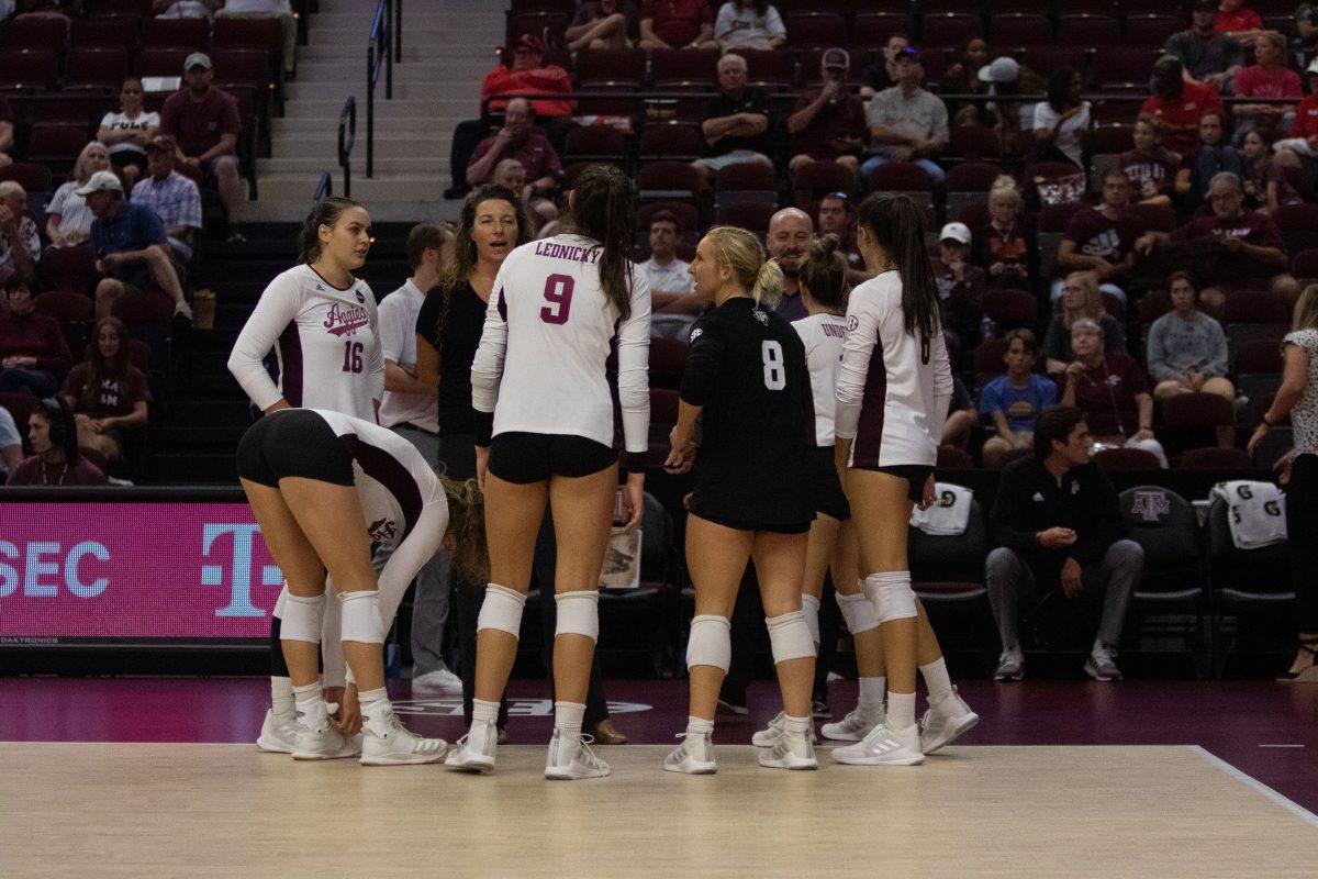 Aggies talk to head coach Laura Bird Kuhn during game at Reed Arena on Friday, Sep. 9, 2022.