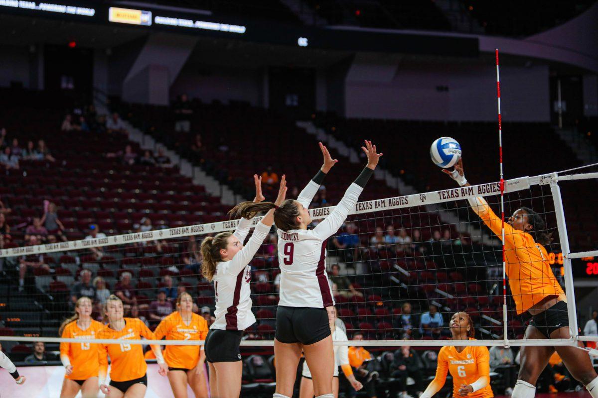 <p>Junior MB Molly Brown (14) and Freshman OPP Logan Lednicky (9)  Block at Reed Arena on Sept. 25, 2022</p>