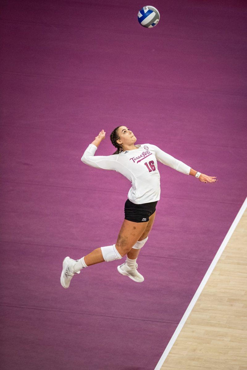 Graduate OH Caroline Meuth (16) serves the ball during the Aggies match against San Diego on Saturday, Aug. 27, 2022 at Reed Arena.