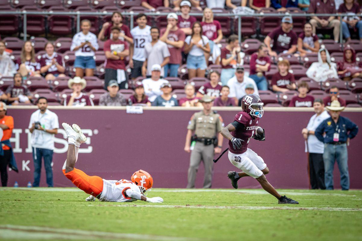 Freshman WR Evan Stewart runs downfield after completing a pass from sophomore QB Haynes King (13) during the Aggies game against Sam Houston State at Kyle Field on Saturday, Sept. 3, 2022.