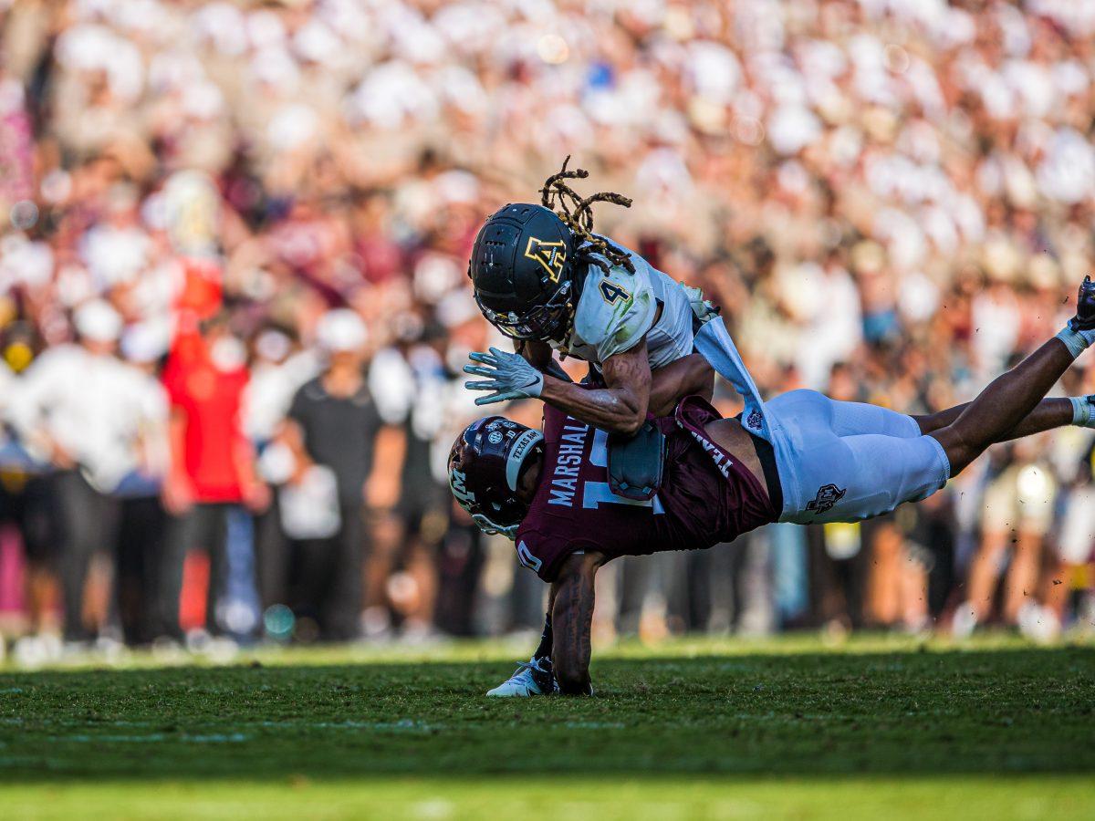 <p>Freshman WR Chris Marshall (10) gets tackled to the ground at Kyle Field on Saturday, Sept. 10, 2022.</p>