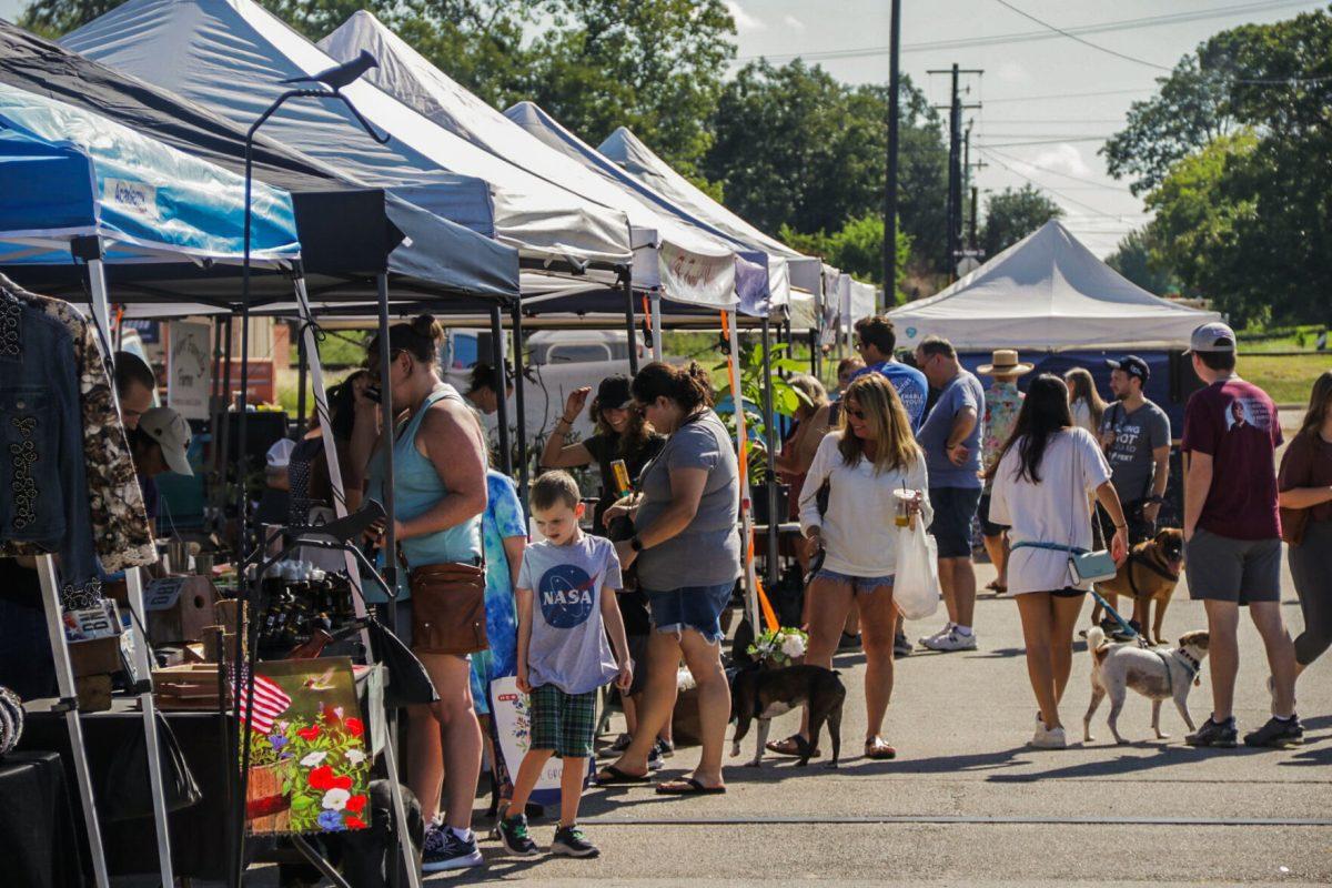 Shoppers walk through the Brazos Valley Farmers’ Market in Downtown Bryan on Saturday, Sept. 24, 2022.