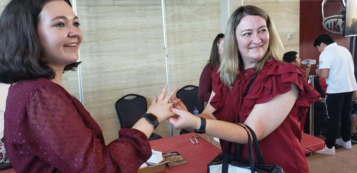 Journalism senior Emma Lawson receives her Aggie ring.&#160;