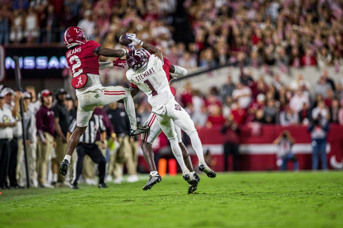Freshman WR Evan Stewart (1) catches a 23 yard pass from sophomore QB Haynes King (13) during a game against the Alabama Crimson Tide on Saturday, Oct. 8, 2022, at Bryant-Denny Stadium in Tuscaloosa, Alabama.