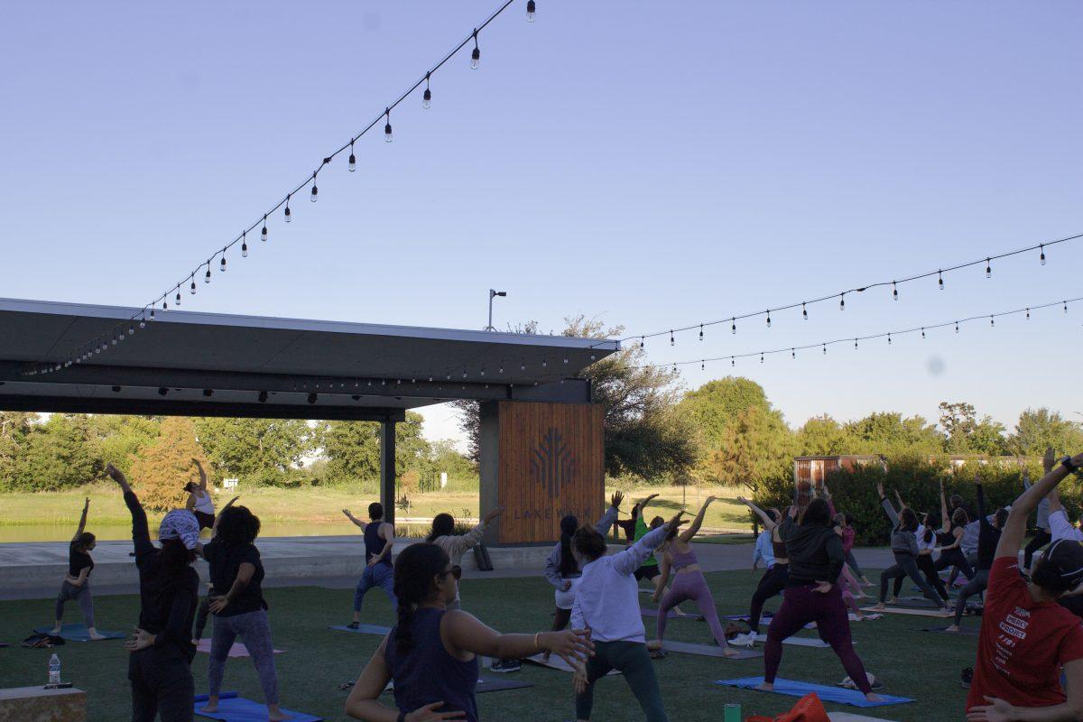 People join Lake Walks yoga class on Saturday, Oct. 1 outside the Stella Hotel. 