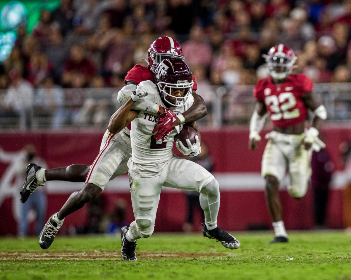 Alabama DB Terrion Arnold reaches to take down graduate WR Chase Lane (2) during a game against the Alabama Crimson Tide on Saturday, Oct. 8, 2022, at Bryant-Denny Stadium in Tuscaloosa, Alabama.
