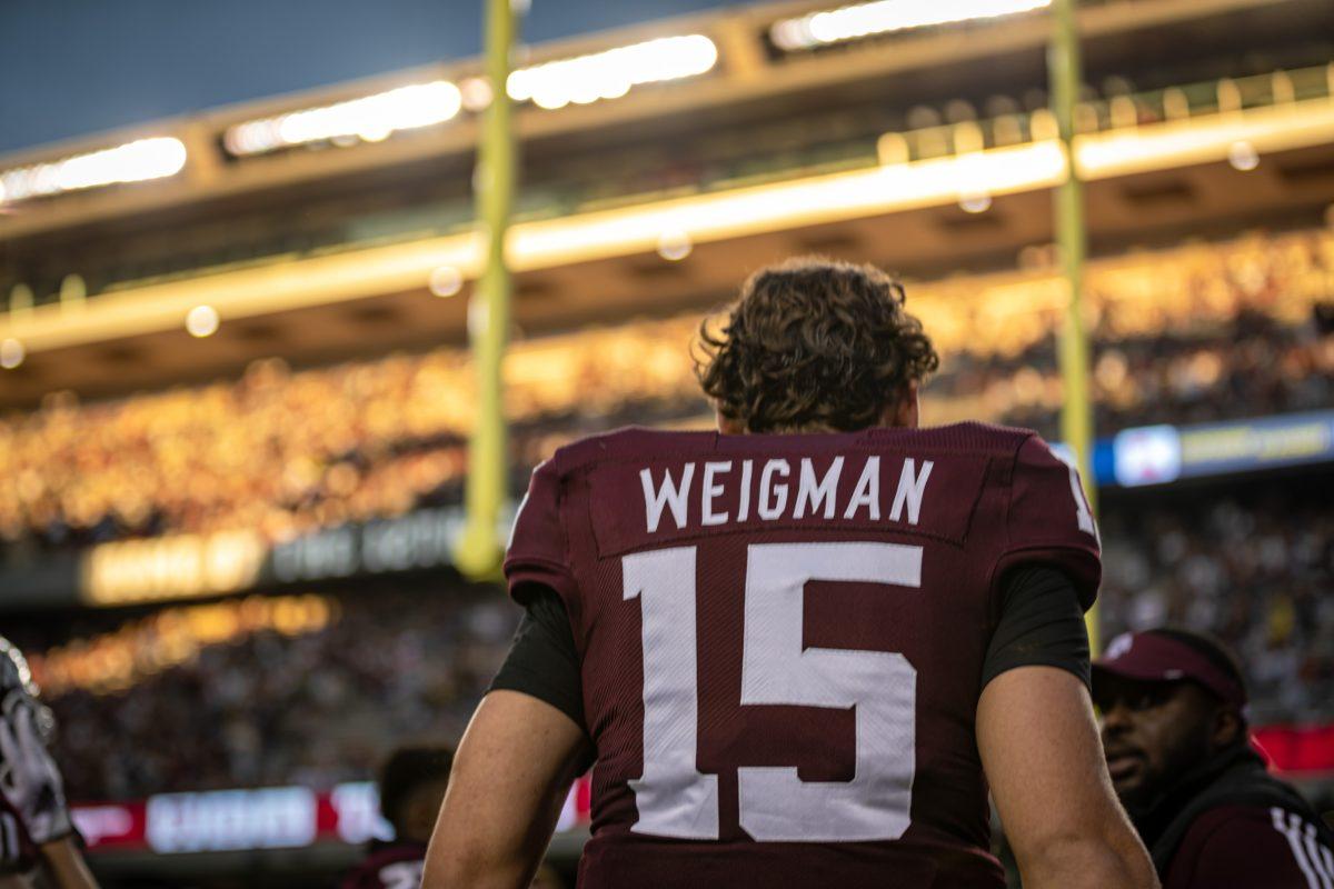 <p>Freshman QB Conner Weigman (15) walks back to the locker room after warming up on the field before Texas A&M's game against Ole Miss at Kyle Field on Saturday, Oct. 29, 2022.</p>