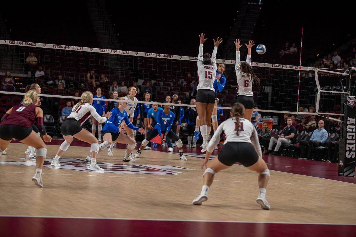 Redshirt Junior MB Madison Bowser (15) and Graduate S Elena Karakasi (6) jump to block the ball during A&Ms match against Kentucky at Reed Arena on Sunday, Oct. 23, 2022.