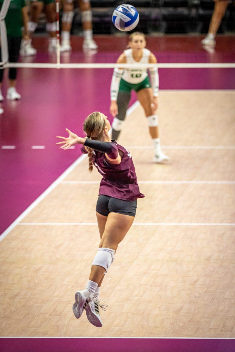 Sophomore L/DS Brooke Frzier (3) serves the ball during the Aggies game against Hawaii in Reed Arena on Friday, Aug. 26, 2022.