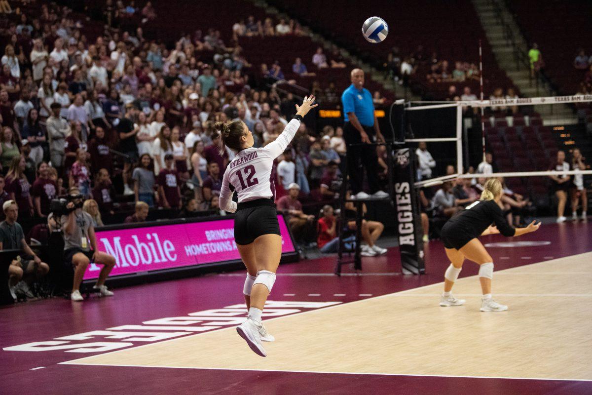 <p>Freshman L/DS Ava Underwood (12) serves the ball at Reed Arena on Friday, Sept. 2, 2022.</p>