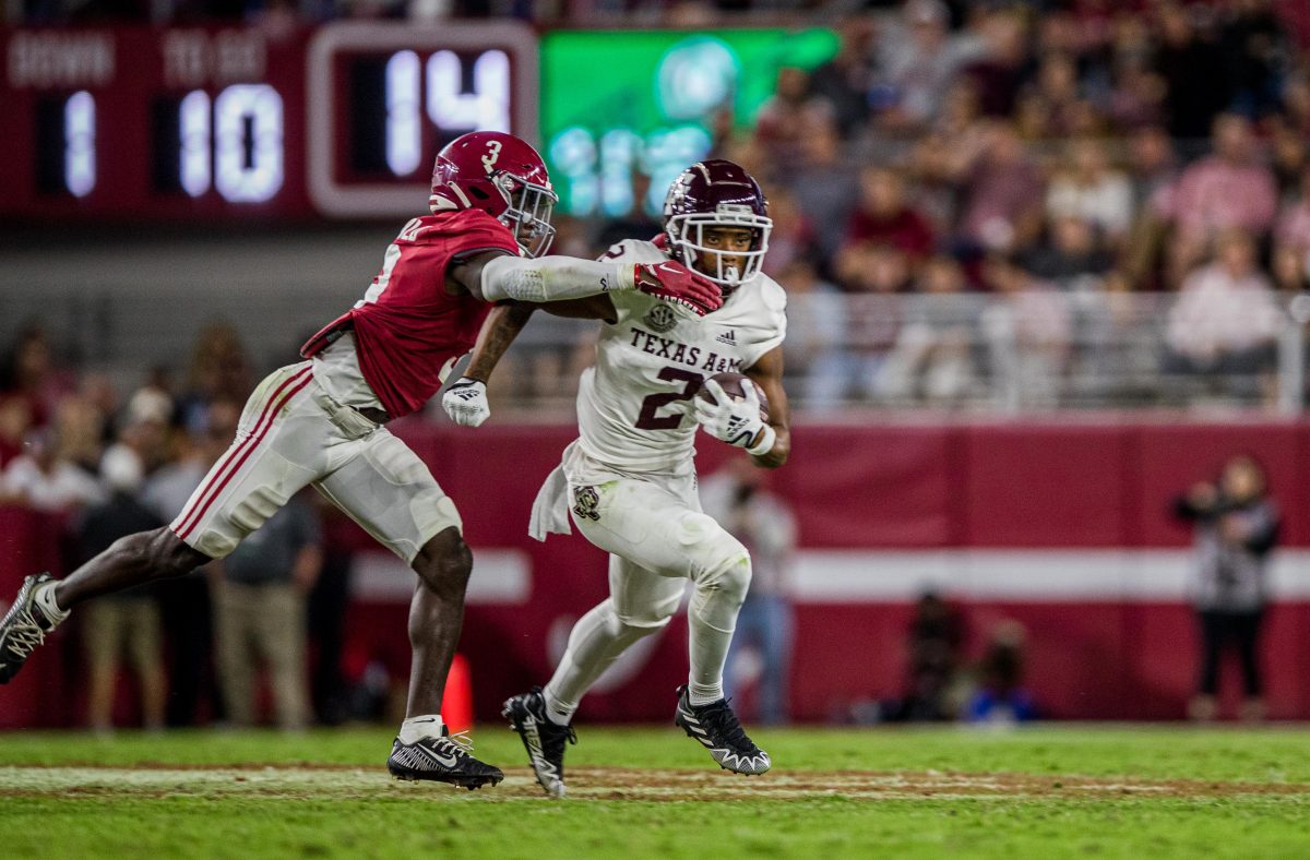 Alabama DB Terrion Arnold reaches to take down graduate WR Chase Lane (2) during a game against the Alabama Crimson Tide on Saturday, Oct. 8, 2022, at Bryant-Denny Stadium in Tuscaloosa, Alabama.