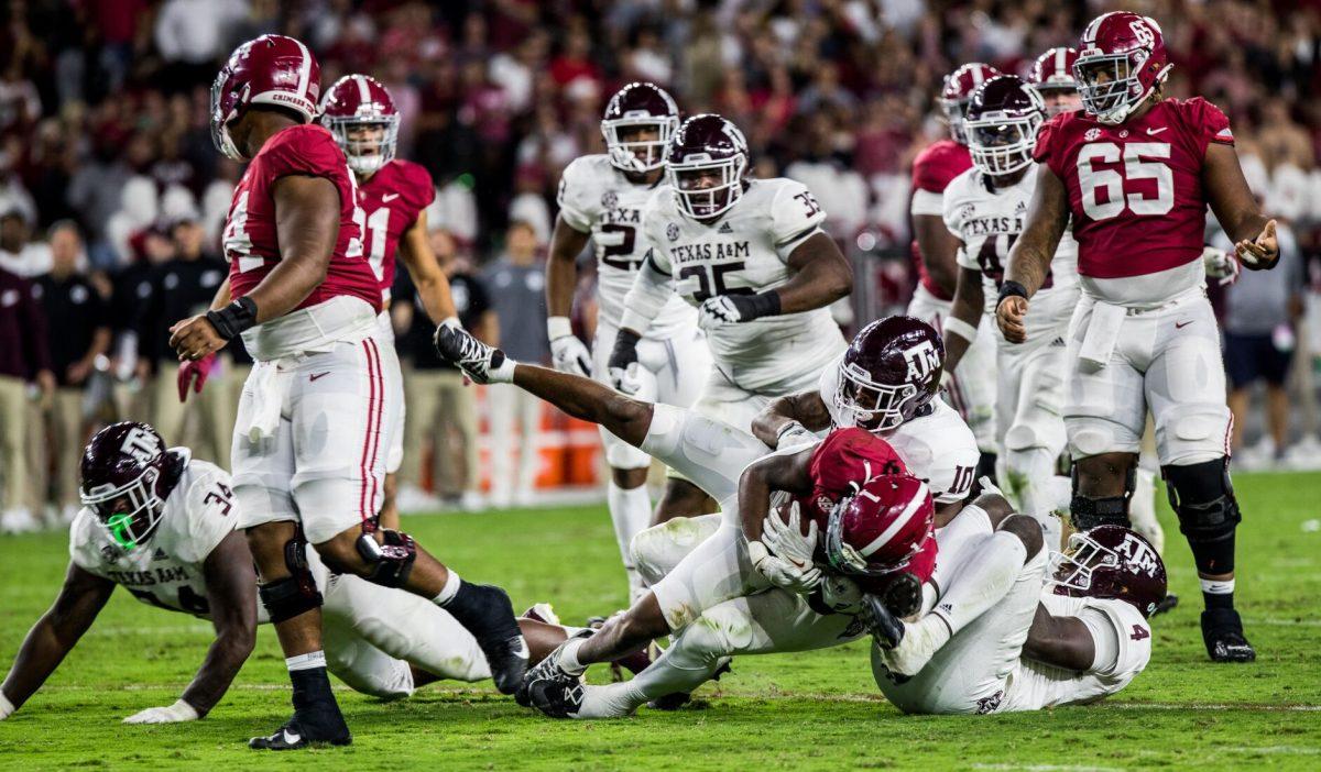 Freshman Fadil Diggs (10) brings down Alabama RB Jahmyr Gibbs (1) during a game against the Alabama Crimson Tide on Saturday, Oct. 8, 2022, at Bryant-Denny Stadium in Tuscaloosa, Ala.