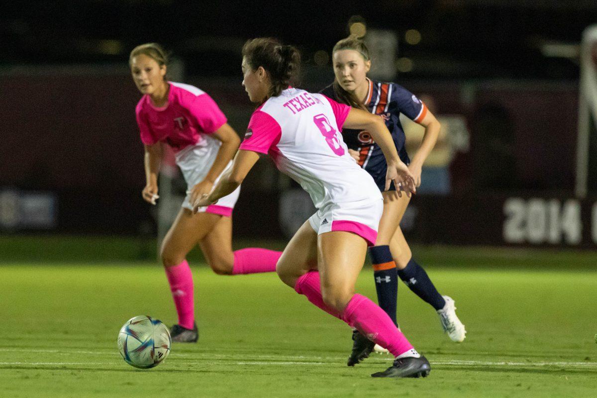 <p>Sophomore F Maile Hayes (8) goes for the ball during Texas A&M's match against Auburn at Ellis Field on Friday, Oct.14, 2022.</p>