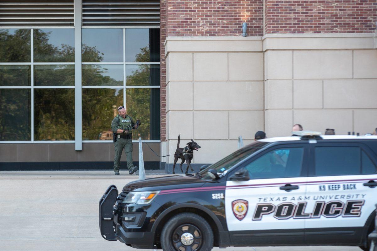 A K-9 unit searches the area around Kyle Field for any explosive devices on Thursday, Oct. 13, 2022.