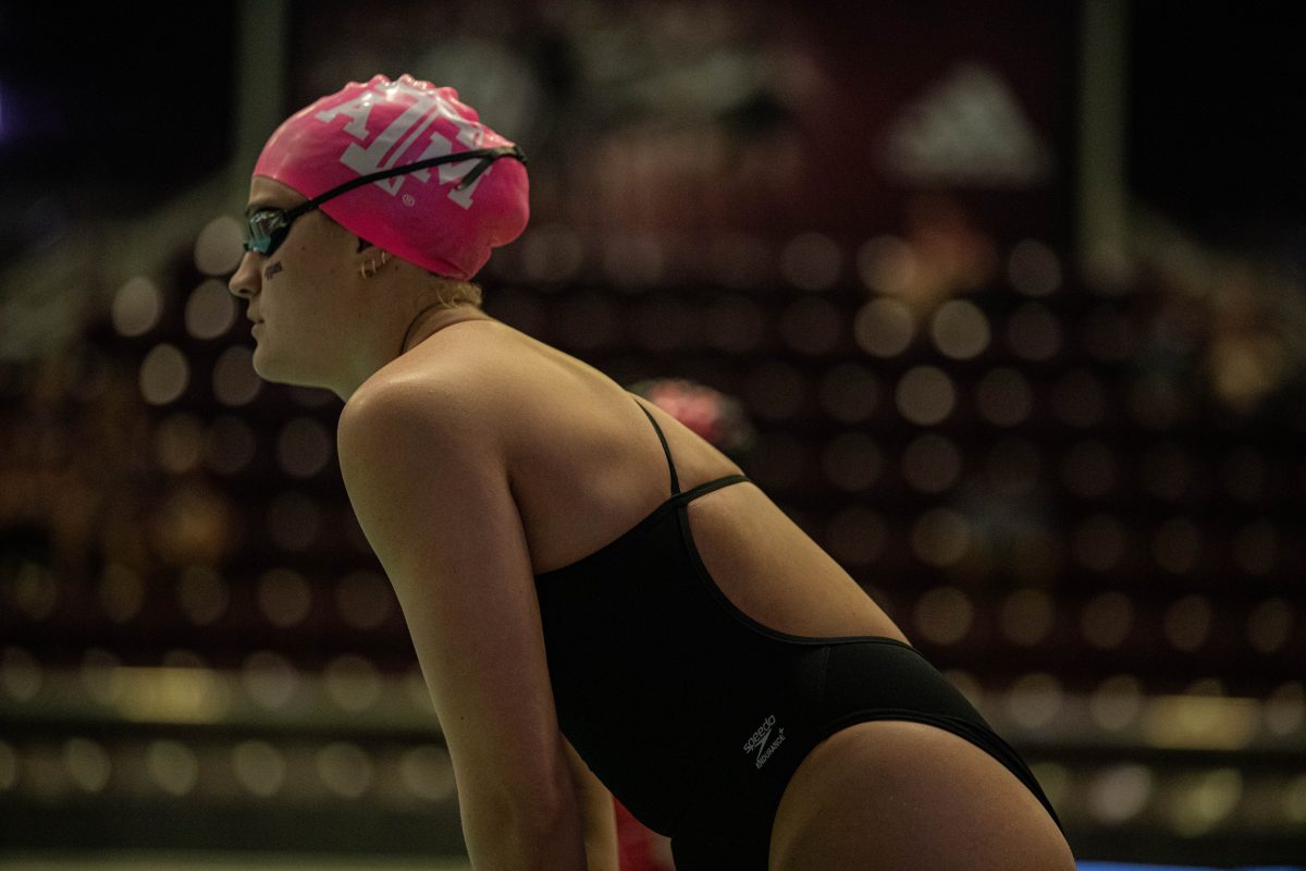 An A&amp;M swimmer on the starting platform during A&amp;M's meet against Houston at the Student Recreation Center Natatorium on Thursday, Oct. 6, 2022.