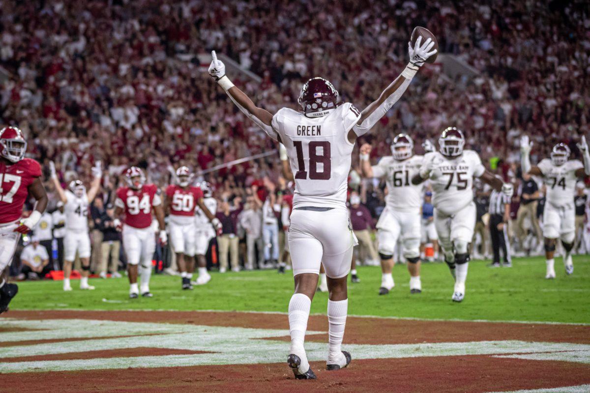 Freshman TE Donovan Green (18) celebrates after completing a touchdown pass during Texas A&amp;M's game against the Alabama Crimson Tide on Saturday, Oct. 8, 2022, at Bryant-Denny Stadium in Tuscaloosa, Alabama.