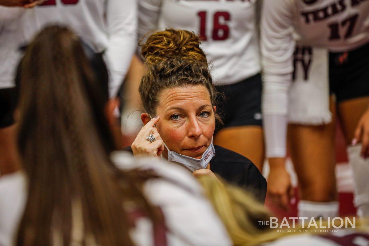 Laura Bird Kuhn discusses strategy with the Texas A&M volleyball team during a timeout. 